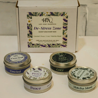 Set of small containers with lids on a white surface, with a branded box labeled 'De-Stress Zone' in the background.