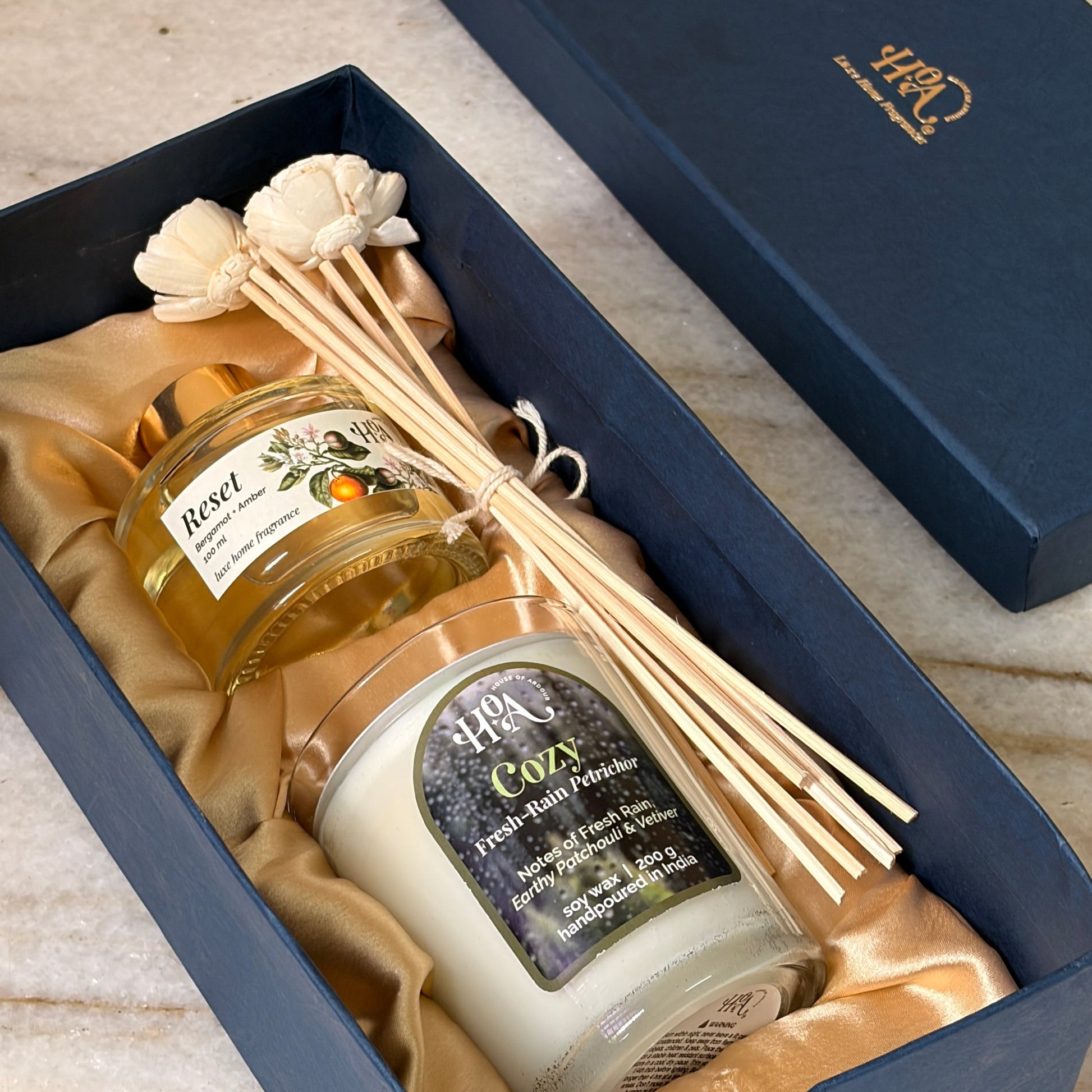 Reed diffuser and Scented Rain Candle in a luxurious gift box with satin 